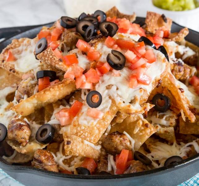 Italian Nachos with Sausage - Crispy wonton chips topped with plenty of cheese and Italian chicken sausage. Great appetizer for game day or any party!