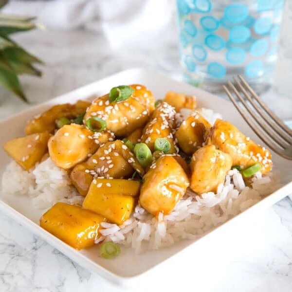 A plate of food on a table, with Chicken pineapple teriyaki