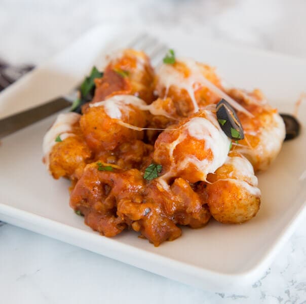 A close up of a pizza tater tot casserole