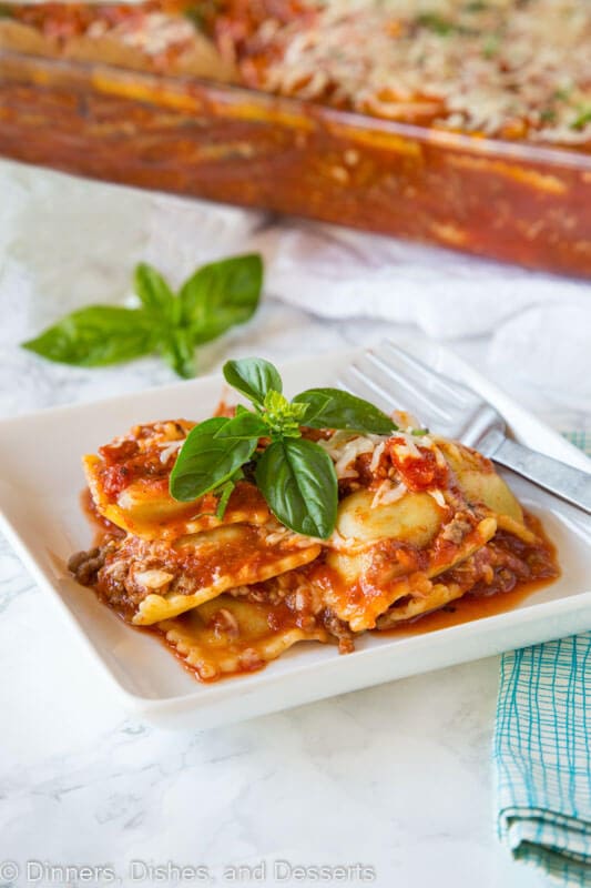 a plate of baked ravioli with basil