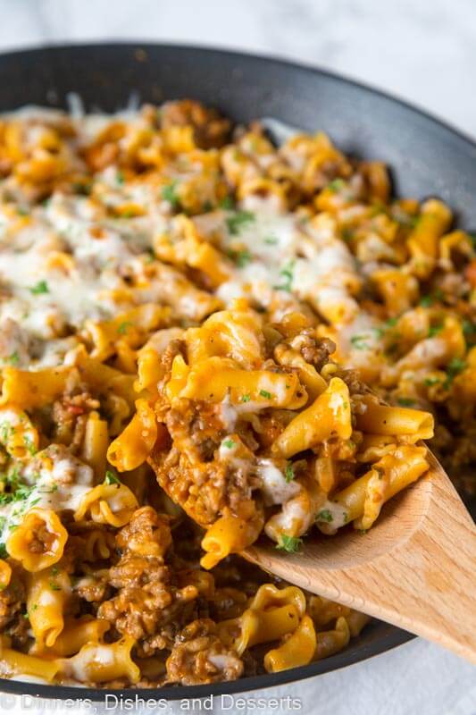 A dish is filled with food, with Hamburger Helper and Sausage