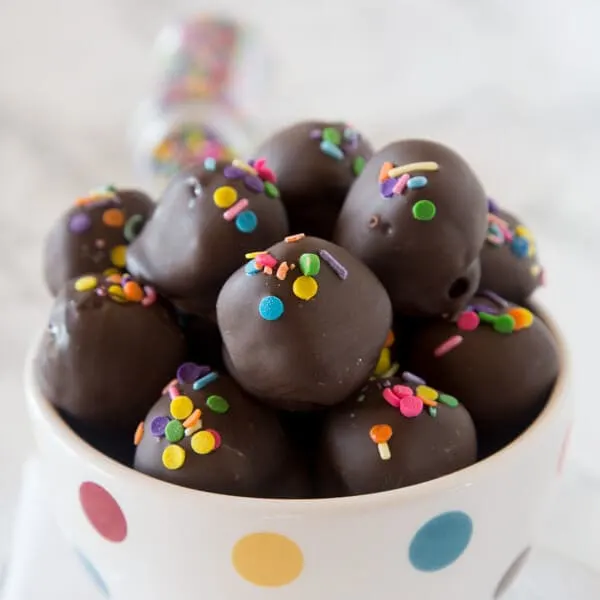 Nutella Oreo Truffles - classic Oreo truffles made even better by adding Nutella! Dipped in chocolate or rolled in sprinkles for an easy chocolate treat.