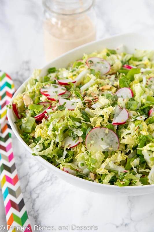 A close up of a bowl of salad, with Cabbage