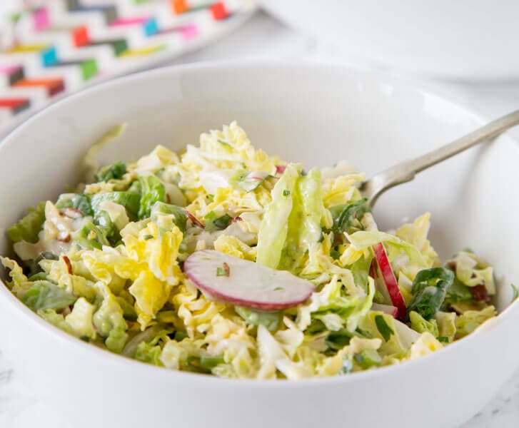 Asian Napa Cabbage Slaw - a crunchy cabbage slaw salad with lots of veggies and a creamy asian style soy dressing. Great for lunches, get togethers or with your next barbecue.