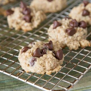 Banana Oatmeal Chocolate Chip Cookies - Tender and super moist chocolate chip cookies loaded with oats and bananas. Thick, chewy, and a fun new treat!