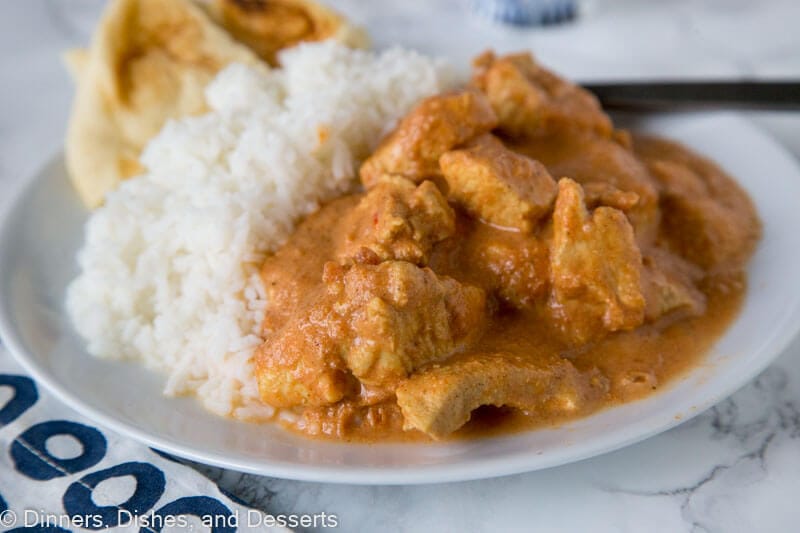 A plate of food, with Butter chicken and Curry