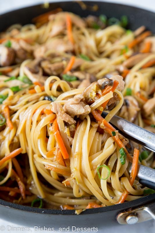 A dish is filled with pasta and veggies