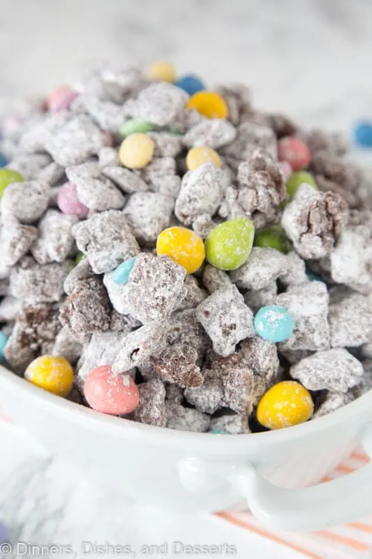 A close up of muddy buddies with easter M&M's
