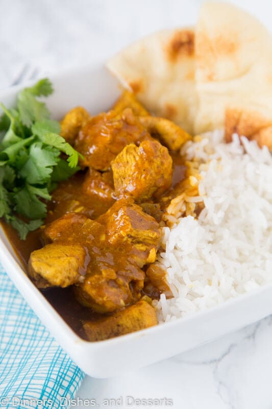 A plate full of food, with Curry and Chicken