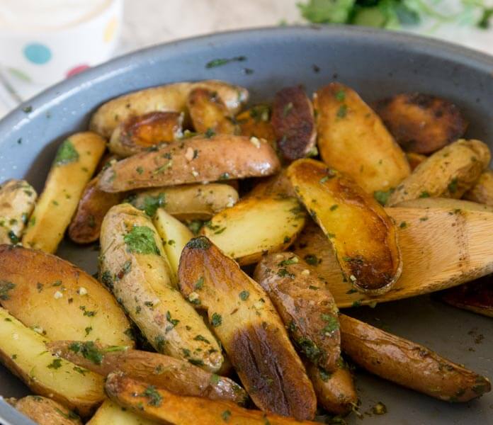Pan Seared Mojo Potatoes - fingerling potatoes are seared and cooked to perfection in just minutes. Then mixed with a cilantro and herb mixture for a delicious side dish.