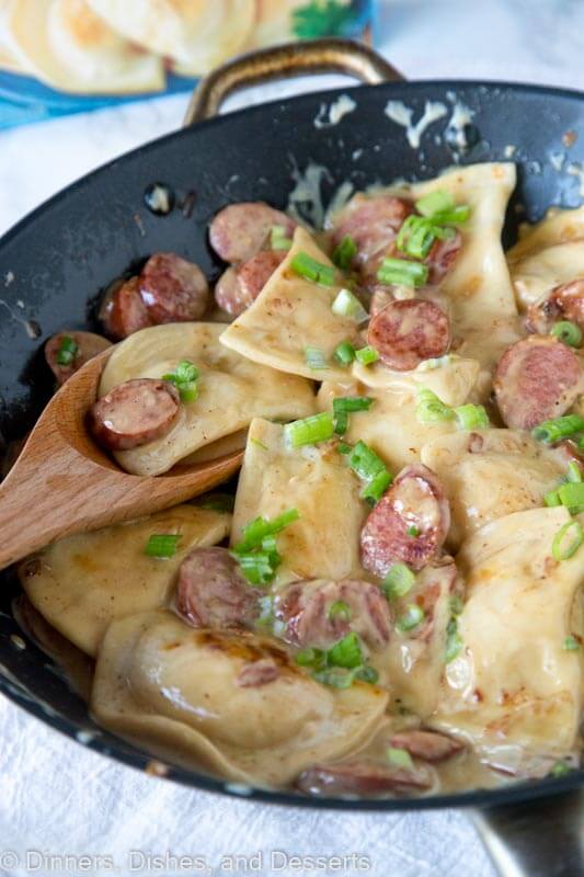 A bowl of food, with Pierogi and Sausage