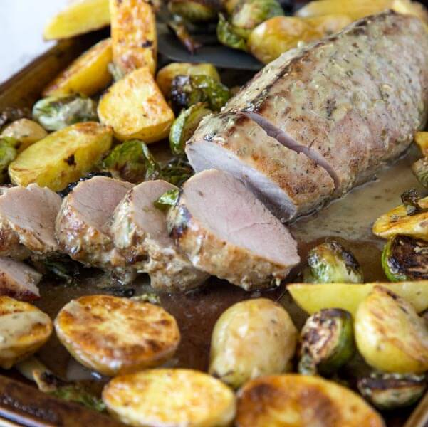 Sheet Pan Pork Tenderloin - tender and juicy pork tenderloin with Brussels sprouts, roasted potatoes and topped with a Dijon herb vinaigrette. Ready quickly, super easy, and so good!