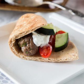 Sheet Pan Greek Meatballs - Greek flavored meatballs make for an easy dinner. Serve with tzatziki sauce for dipping and pitas to make gyros.