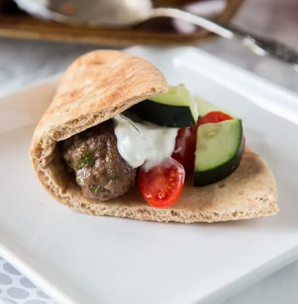 Sheet Pan Greek Meatballs - Greek flavored meatballs make for an easy dinner. Serve with tzatziki sauce for dipping and pitas to make gyros.