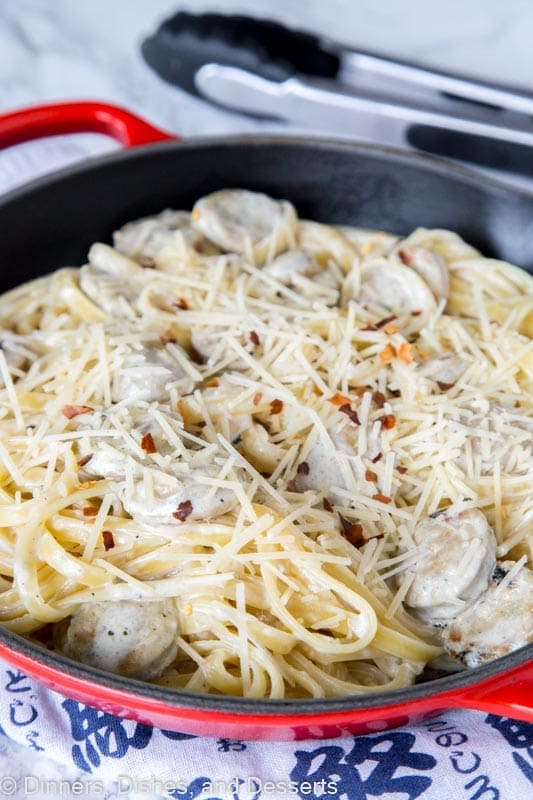 skillet with  pasta with sauce and cheese, with chicken sausage and Fettuccine Alfredo