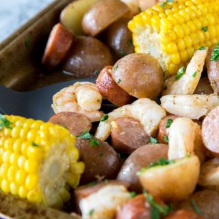 Sheet Pan Shrimp Boil - an easy homemade version of a classic shrimp boil, made in the oven. Shrimp, sausage, potatoes, and corn make for one amazing meal!