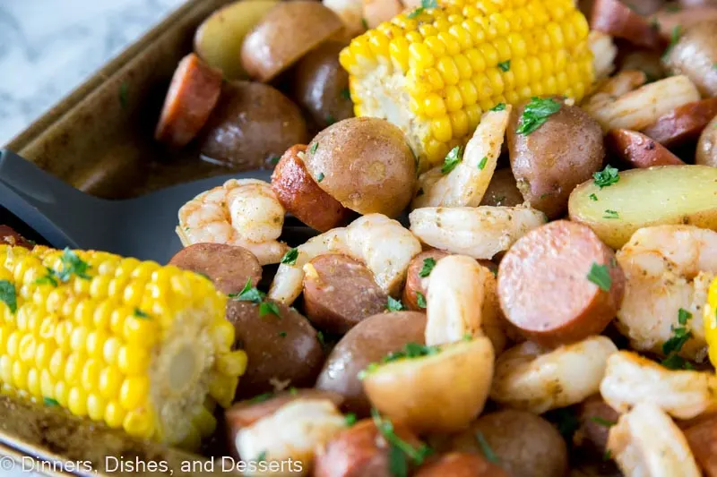 A dish is filled with food, shrimp boil