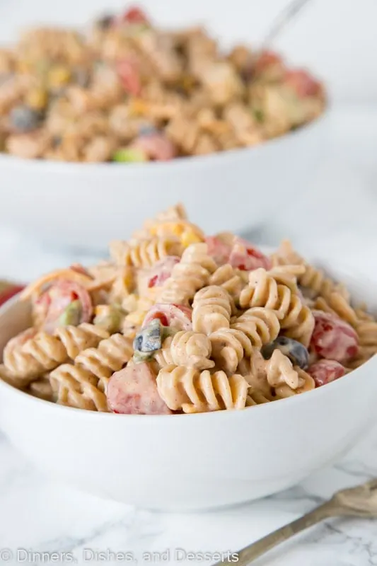 Taco Pasta Salad - a creamy pasta salad with all your favorite taco toppings! Great to make ahead and have in the fridge for dinner or to take to any get together.