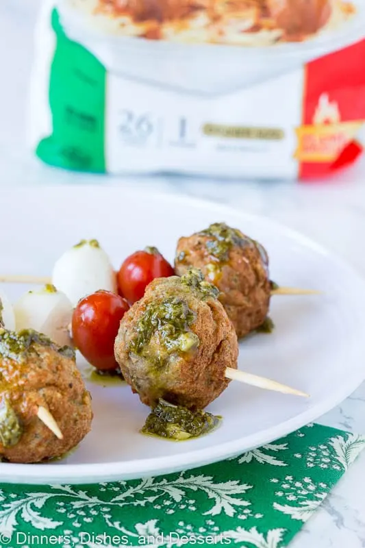 meatball skewer with mozzarella cheese, tomato, meatball and pesto