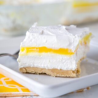 Lemon Lasagna Dessert Recipe - Why not turn lasagna into dessert with layers of cookies, cream cheese, lemon pudding and whipped cream. A creamy and delicious no bake dessert.