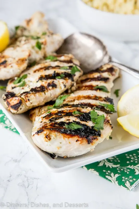 Yogurt Marinated Chicken - chicken breasts marinated in a blend of yogurt, lemon juice, and Greek seasonings. Then grilled to perfection. A quick and easy dinner all summer long.
