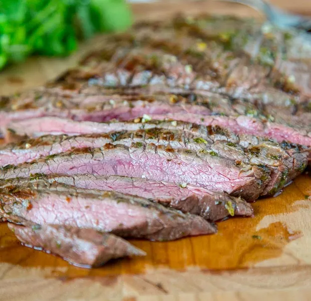 Grilled Chile Lime Flank Steak - flank steak that is marinated in olive oil, lime juice, cilantro, and jalapeno. Then grilled in just minutes for a super fast meal the whole family will love. 