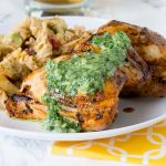 Grilled Chicken Thighs with Chile Herb Sauce - chicken thighs marinated in a blend of garlic, spices and lime juice. Grilled and then topped with a creamy herb and jalapeno sauce.