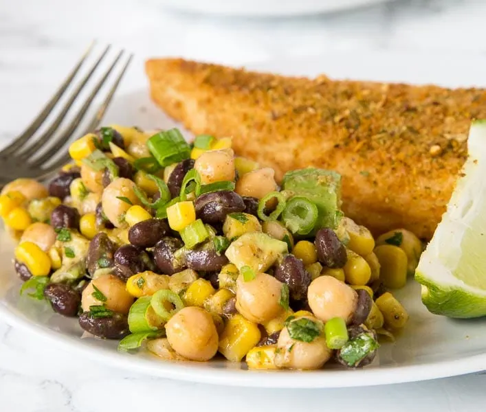 Southwestern Chickpea Salad - chickpeas and black beans with corn and avocado in a Southwestern style dressing. A great healthy and fresh summer side dish. 