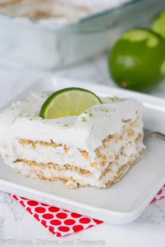A piece of key lime ice box cake with a fork