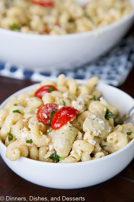 Mediterranean Pasta Salad - an easy pasta salad full of olives, artichoke hearts, tomatoes, parsley, and feta cheese. Topped with a light vinaigrette dressing for a cool and delicious dish. 