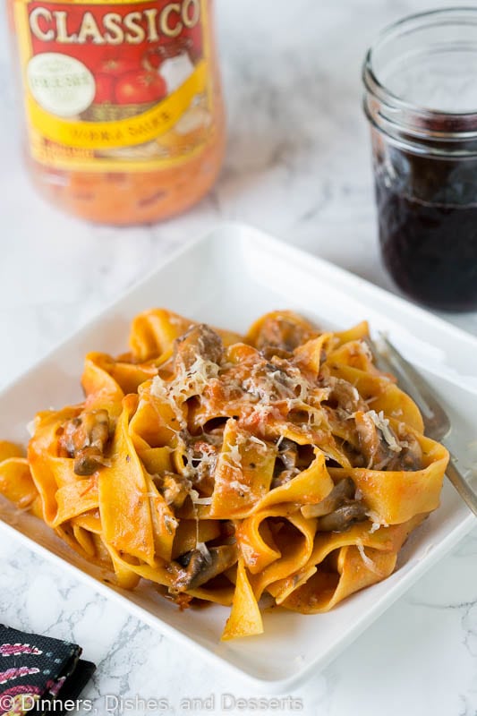 A plate of pasta with a mushroom tomato sauce