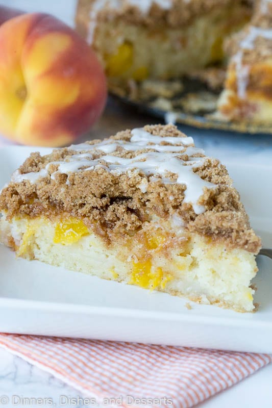 A piece of peach coffee cake on a plate