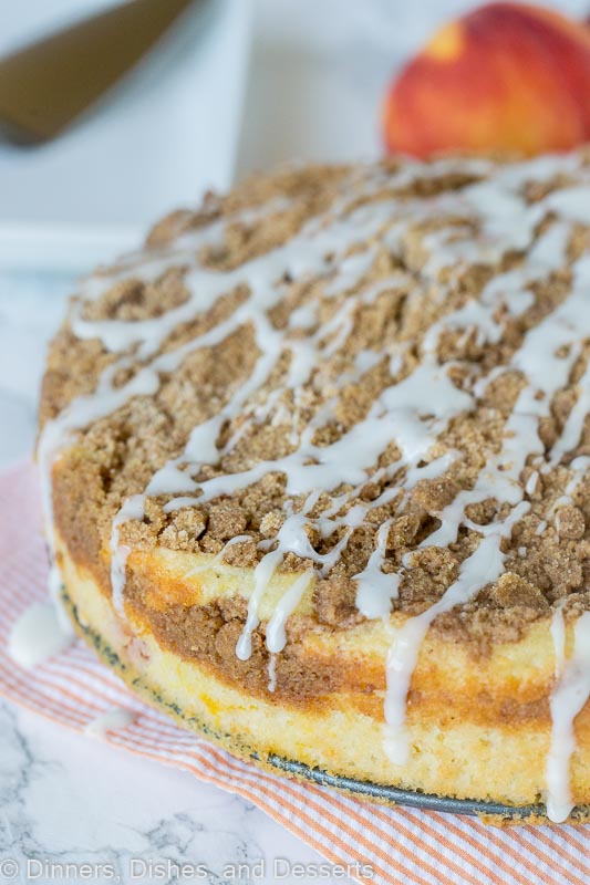 a peach coffee cake with vanilla glaze