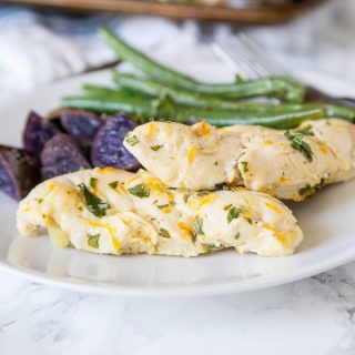 Oven Baked Chicken and Potatoes - a one pan chicken dinner with citrus, olive oil, and basil marinated chicken, green beans and roasted potatoes.
