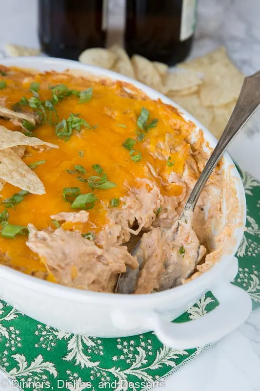 barbecue chicken dip in a dish with a spoon