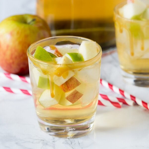 Caramel Apple Sangria - enjoy an easy sangria recipe that is perfect for fall.  Apple cider and caramel vodka make for a fun and fruity cocktail!