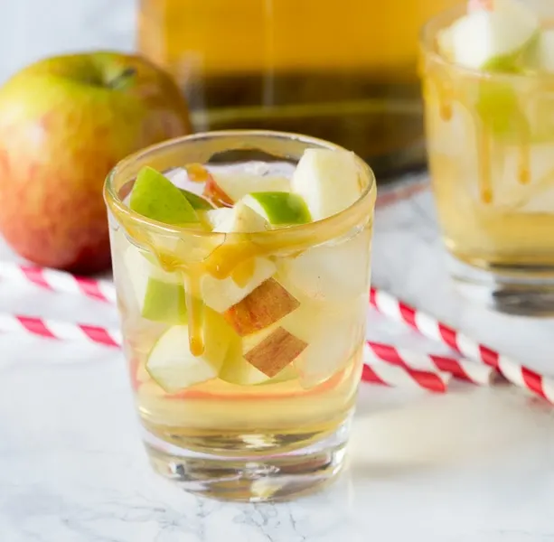 Caramel Apple Sangria - enjoy an easy sangria recipe that is perfect for fall.  Apple cider and caramel vodka make for a fun and fruity cocktail!