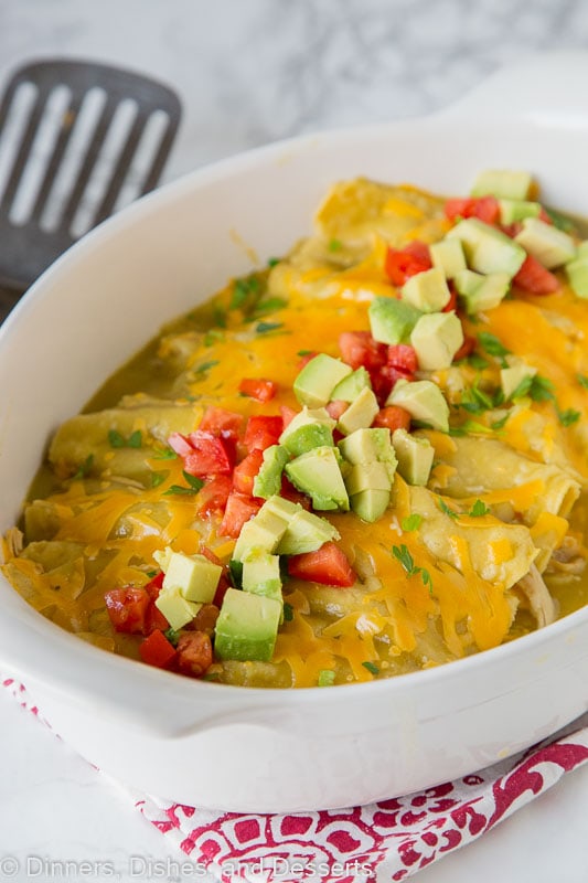 Green Chile Chicken Enchiladas - this super easy chicken enchilada recipe is loaded with chicken, cheese and topped with a green chile sauce!
