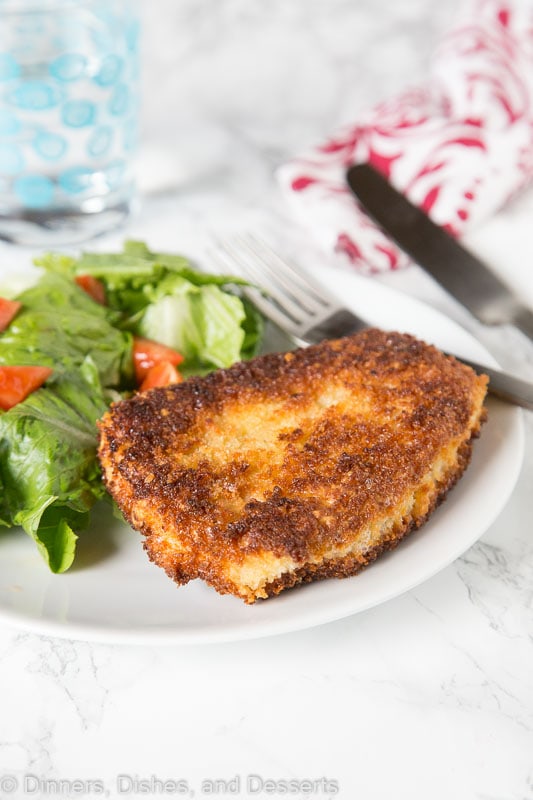 Crispy Pork Cutlet - tender boneless pork chops breaded and pan fried to crispy perfection. Served with a salad for a delicious meal any night of the week. 