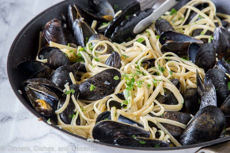 A bowl of food, with Mussel and Pasta