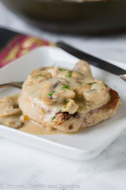How to Cook Pork Chops - topped with a creamy mushroom gravy!