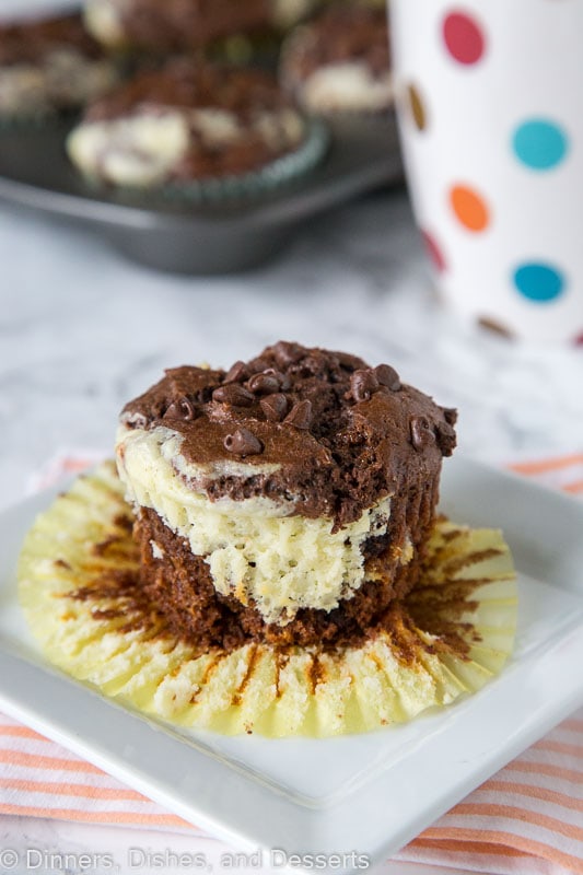 A close up of a piece of chocolate cheesecake muffin on a plate