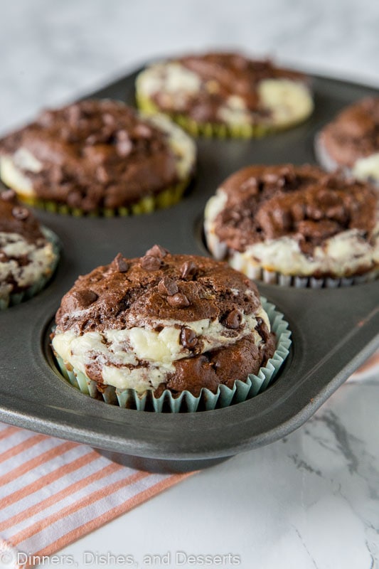 Double Chocolate Cheesecake Muffins - Rich, chocolate muffins with a layer of sweetened cream cheese for a light and tender breakfast or even dessert. 