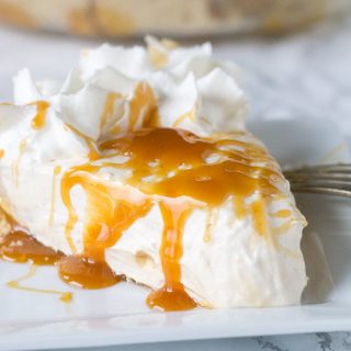 Vanilla Caramel Pie – An easy vanilla cream pie with lots of caramel mixed in.  Topped with homemade whipped cream and a caramel drizzle. Great for holiday entertaining!