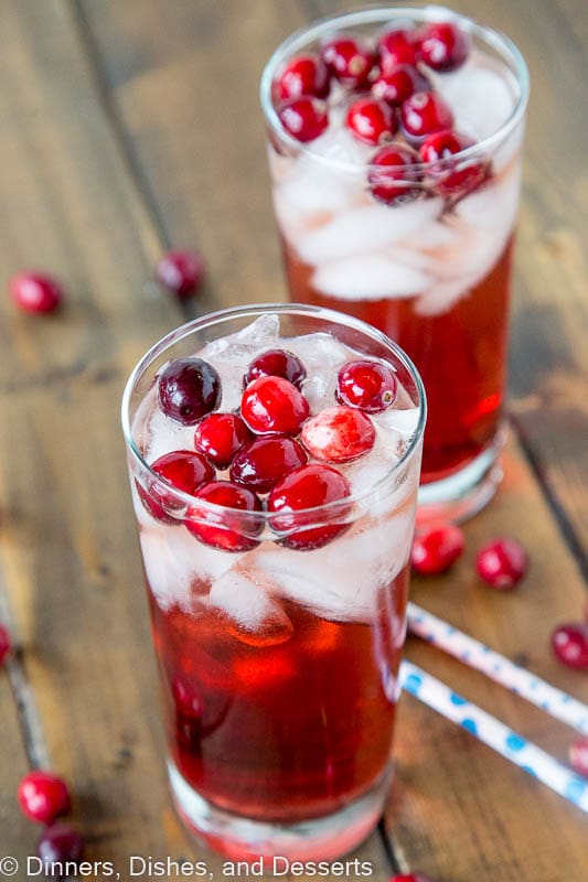 Holiday Wine Spritzer Recipe - a fun cocktail that you can serve at all your holiday get togethers!  Wine, ginger ale, cranberry juice and cranberries make it festive and delicious!