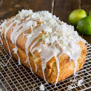 Coconut Lime Quick Bread - soft and tender coconut bread with hints of lime, topped with a lime glaze and flakes of sweetened coconut.