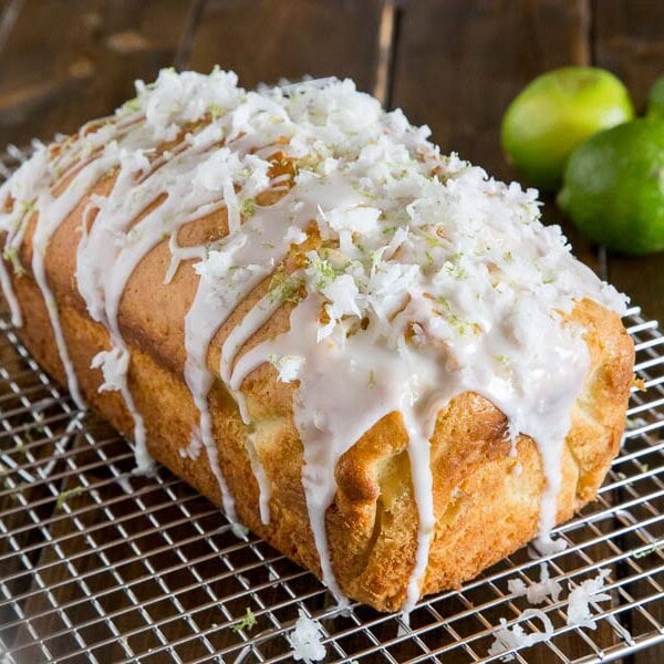 Coconut Lime Quick Bread - soft and tender coconut bread with hints of lime, topped with a lime glaze and flakes of sweetened coconut.