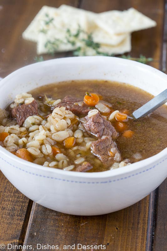 Beef and Barely soup in white bowl