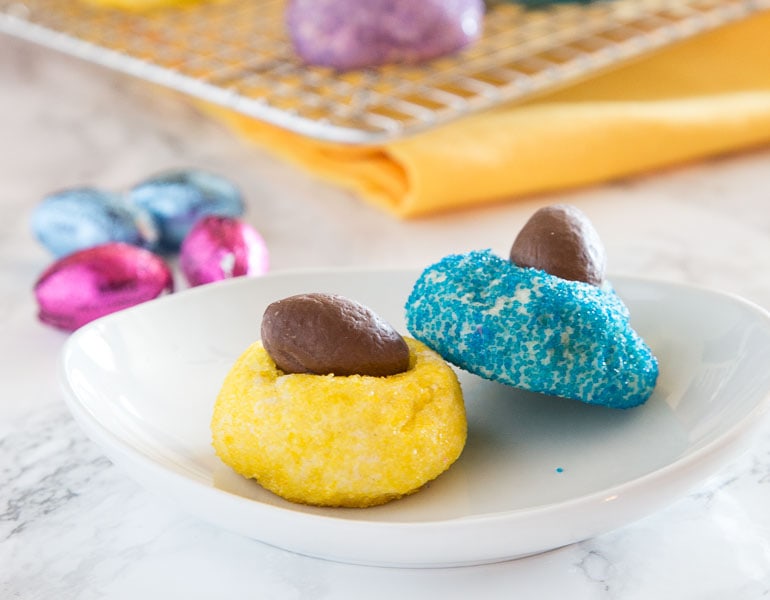 Mini Chocolate Egg Blossom Cookies - get ready for Easter with these fun blossom cookies!  Sugar cookie blossoms rolled in colored sugar and then topped with a chocolate egg!  