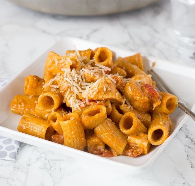 Bruschetta Chicken Pasta - an easy chicken pasta loaded with lots of tomatoes, seasoned chicken, and topped with Parmesan cheese.  Easy to make and ready quickly for any night of the week.